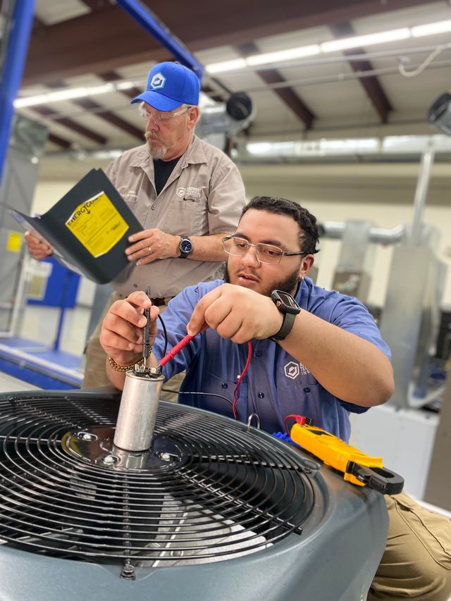 HVAC/R student testing a fan