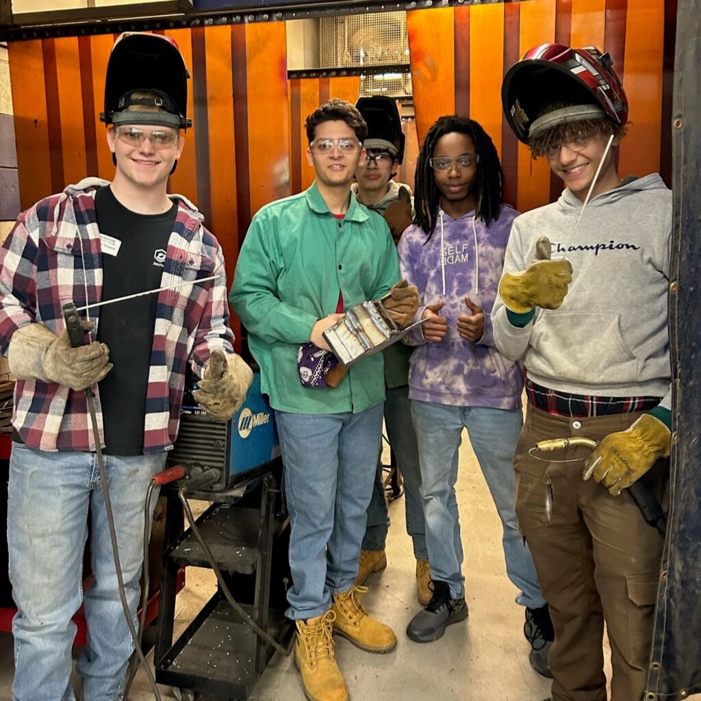 welding students smiling